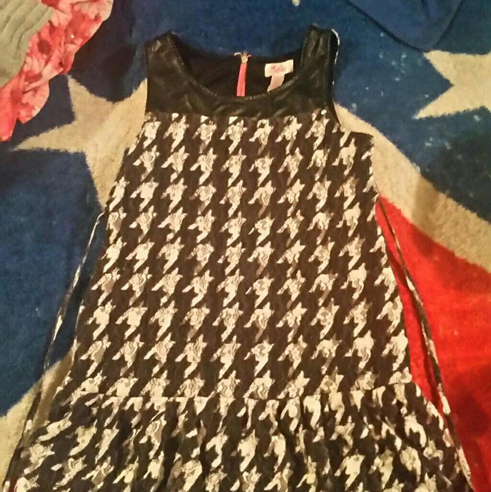 A black and white knee length dress